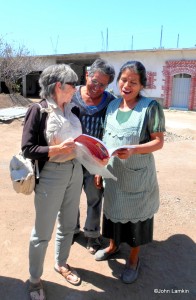 Susanna shows the book to Eliseo & Maria Bautista