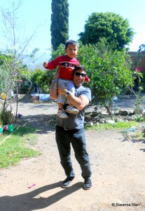 Roy holding Alta's grandson Pablito